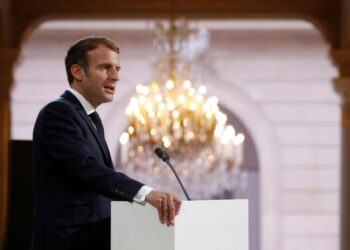 French President Emmanuel Macron delivers a speech during a meeting in memory of the Algerians who fought alongside French colonial forces in Algeria's war, known as Harkis, at the Elysee Palace in Paris, Thursday, Sept. 20, 2021. Macron's speech is the latest step in his efforts to reconcile France with its dark colonial past, especially in Algeria. (Gonzalo Fuentes/Pool Photo via AP)