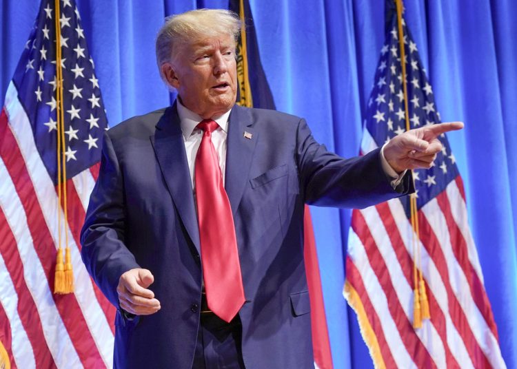 FILE - Former President Donald Trump gestures after speaking during the North Carolina Republican Party Convention in Greensboro, N.C., June 10, 2023. The latest indictment of Donald Trump alleges the former president conspired to overturn the will of voters and disrupt the peaceful transfer of power. Yet Trump's most devoted followers claim these serious criminal charges actually show that Trump is the victim of political persecution. (AP Photo/Chuck Burton, File)